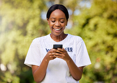 Buy stock photo Chat, park volunteering and black woman with a phone for social media, email or communication. Happy, web and African volunteer or charity worker in nature for cleaning with a mobile for notification