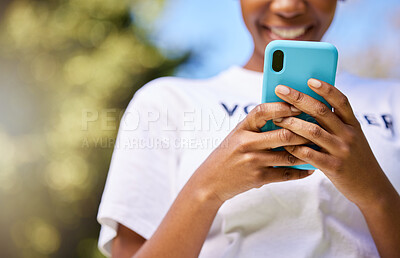 Buy stock photo Black woman, phone and hands typing in nature for communication, social media or outdoor networking. Closeup of happy African female person smile in chatting or texting on mobile smartphone app
