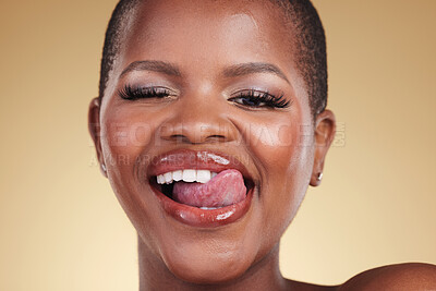 Buy stock photo Wink, lick lips and beauty of a woman in studio for skin care, makeup and cosmetics. Face of a happy african model person with facial shine, dermatology and wellness or flirting on a beige background