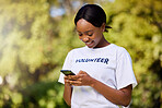 Woman, phone and volunteering in park with social media FAQ, blog or community service website. Happy african student on mobile or chat for earth day information, NGO or nonprofit contact in nature