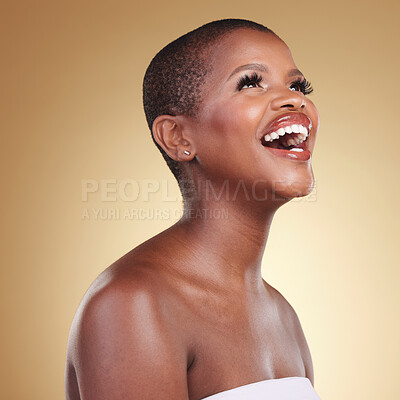 Buy stock photo Beauty, makeup and a black woman laughing in studio for skin care, glow and funny cosmetics. Face of a happy african model person with facial shine, dermatology and wellness on a beige background