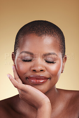 Buy stock photo Beauty, natural makeup and face a black woman in studio for skincare, glow and cosmetics. Headshot of African person with facial shine, dermatology and self care for wellness on beige background