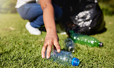 Buy stock photo Volunteer, hands and plastic or cleaning park, community service and recycling for climate change or earth day project. Person volunteering in garden or grass with eco friendly action, bottle and bag