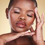 Makeup, beauty portrait and face of a black woman in studio for skin care, glow and cosmetics. Headshot of african person or model with facial shine, dermatology and wellness on a beige background