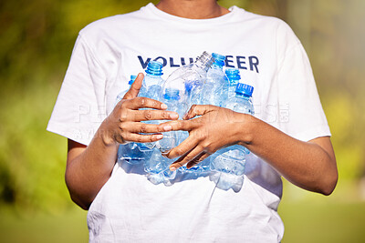 Buy stock photo Volunteer hands, plastic bottle and park for community service, recycling and climate change or earth day project. Person volunteering outdoor or nature for eco friendly cleaning or nonprofit support