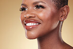 Beauty, makeup and face of a happy black woman in studio for self care, skincare and cosmetics. Closeup of African aesthetic model person with facial shine, teeth smile and glow on a beige background