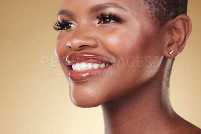 Buy stock photo Beauty, makeup and face of a happy black woman in studio for self care, skincare and cosmetics. Closeup of African aesthetic model person with facial shine, teeth smile and glow on a beige background