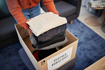 Buy stock photo Donation box, charity and hands with clothes for nonprofit and cardboard container at home. Moving, donating and house with giveaway and spring cleaning for community care support with packing