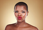 Black woman, lips and kiss, red lipstick and beauty with makeup and portrait isolated on studio background. Pout, cosmetics product on mouth and bold color with headshot, shine and cosmetology