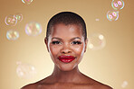 Beauty, makeup and bubbles with portrait of black woman in studio for cosmetics, spa treatment and luxury. Skincare, dermatology and self care with model on gold background for glow, facial and soap