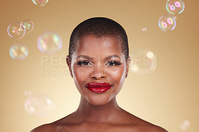 Buy stock photo Beauty, makeup and bubbles with portrait of black woman in studio for cosmetics, spa treatment and luxury. Skincare, dermatology and self care with model on gold background for glow, facial and soap
