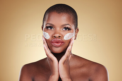 Buy stock photo Beauty, cream and face of black woman in studio for self care, skincare or cosmetics. Headshot of african person or aesthetic model with facial moisturizer, dermatology and glow on a beige background