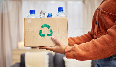 Buy stock photo Plastic, recycle and hands with bottle in box in living room for eco friendly, reuse and renewable litter. Sustainability, conservation and person with container to reduce waste, litter and garbage