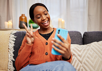 Buy stock photo Selfie, black woman and peace sign at home with a smile for social media, motivation and video call. Photo, happy and African female person in a living room with a v and emoji hand gesture at house