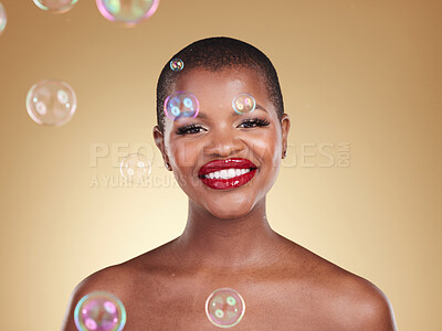 Buy stock photo Smile, makeup and bubbles with portrait of black woman in studio for cosmetics, spa treatment and luxury. Skincare, dermatology and self care with model on gold background for glow, facial and beauty