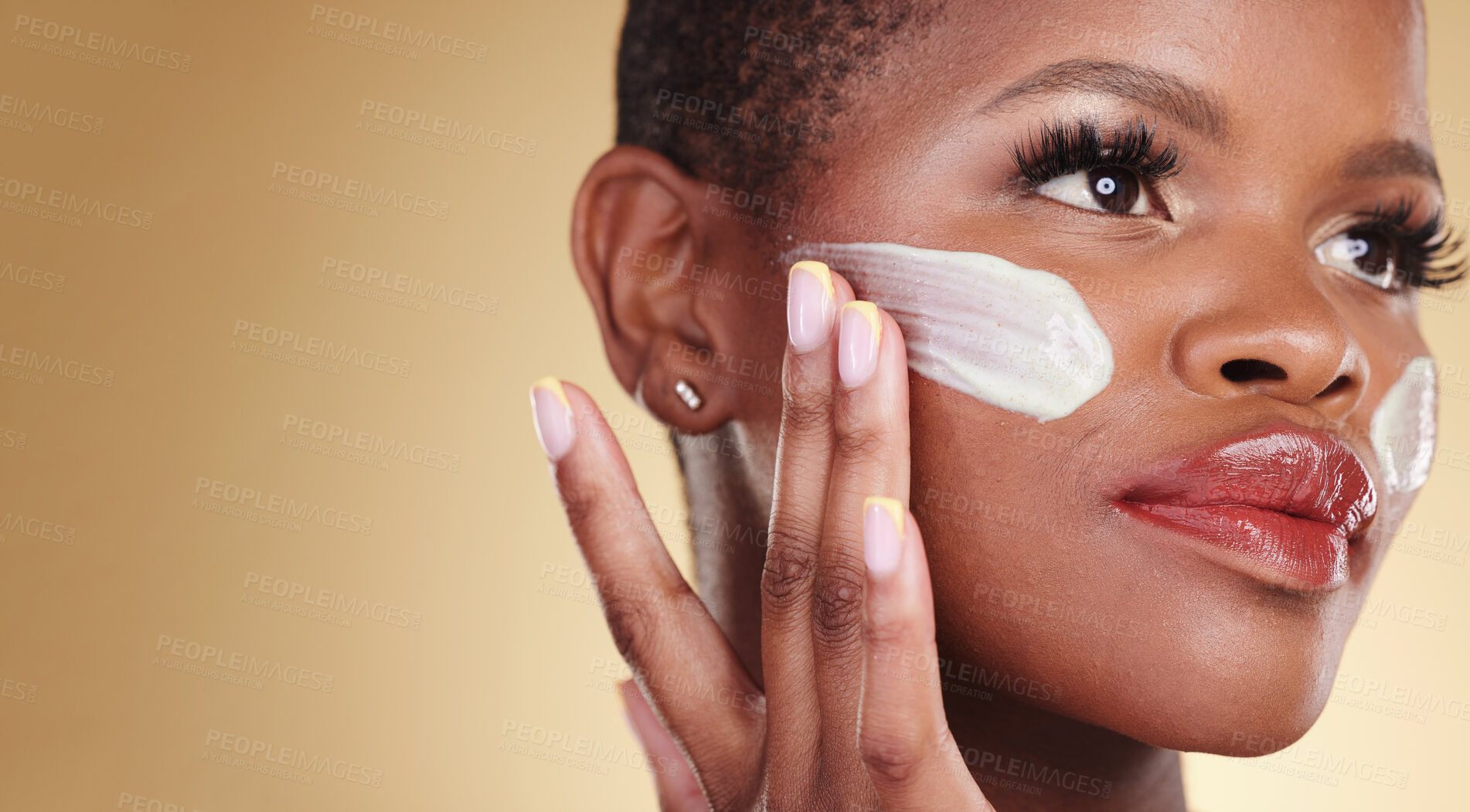 Buy stock photo Skincare, application and face cream for black woman in studio for dermatology or cosmetic results on brown background. Beauty, hand and model with facial, sunscreen or collagen, mask or application
