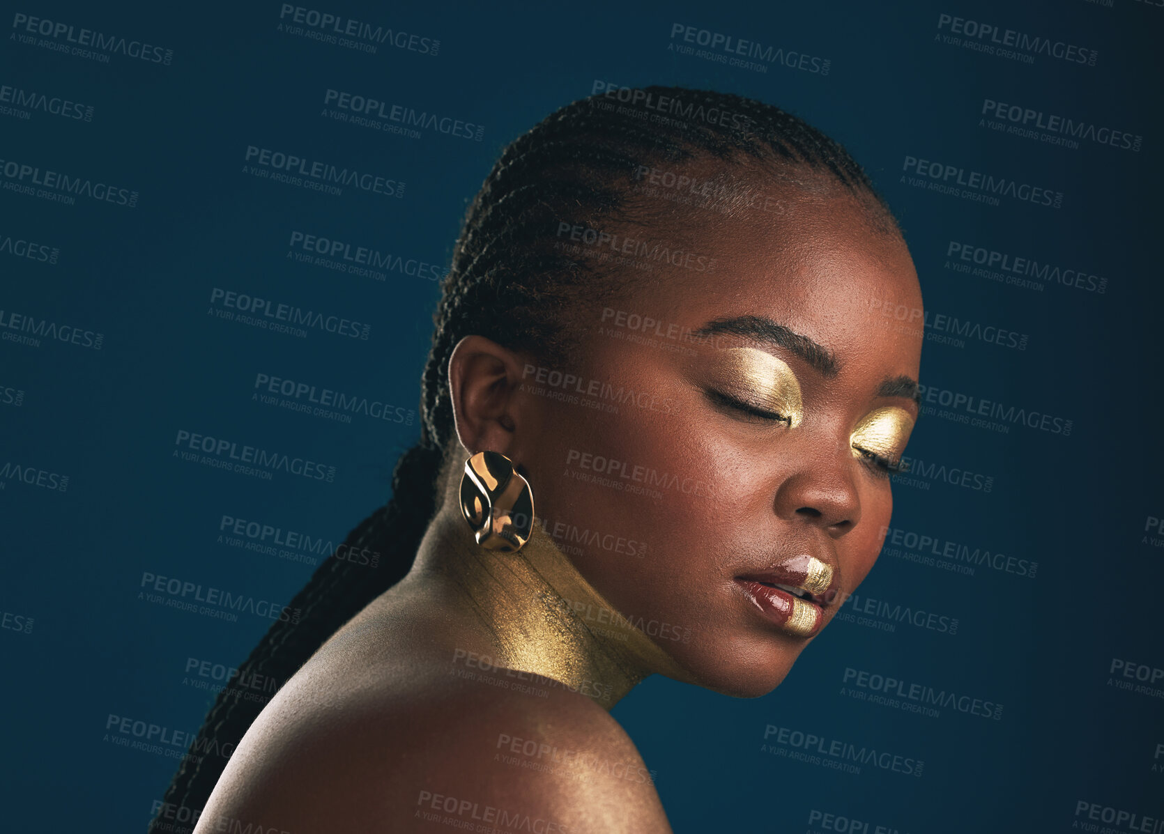 Buy stock photo Gold makeup, studio face and black woman relax with creative art, facial cosmetics paint and beauty. African culture, color and person with eyes closed, wellness and creativity on blue background
