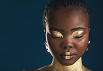 Gold makeup, face and black woman relax with creative art mockup, facial cosmetics paint or beauty advertising space. African culture, color and studio person glow with eyes closed on blue background