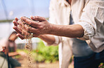 Farming, hands and outdoor with soil, sand or dirt for growth, inspection or drought at agro job. Person, dry dust and holding for agriculture, climate change or sustainability in closeup for ecology