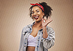 Woman, ok sign and studio portrait with smile, tongue and funny face for good review by brown background. African girl, student or fashion model with hand for icon, vote or feedback with comic laugh