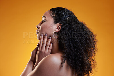 Buy stock photo Beauty, curly and hair with profile of woman in studio for texture, makeup and cosmetics. Self care, salon and hairstyle with model on orange background for skincare, spa treatment and glow mockup