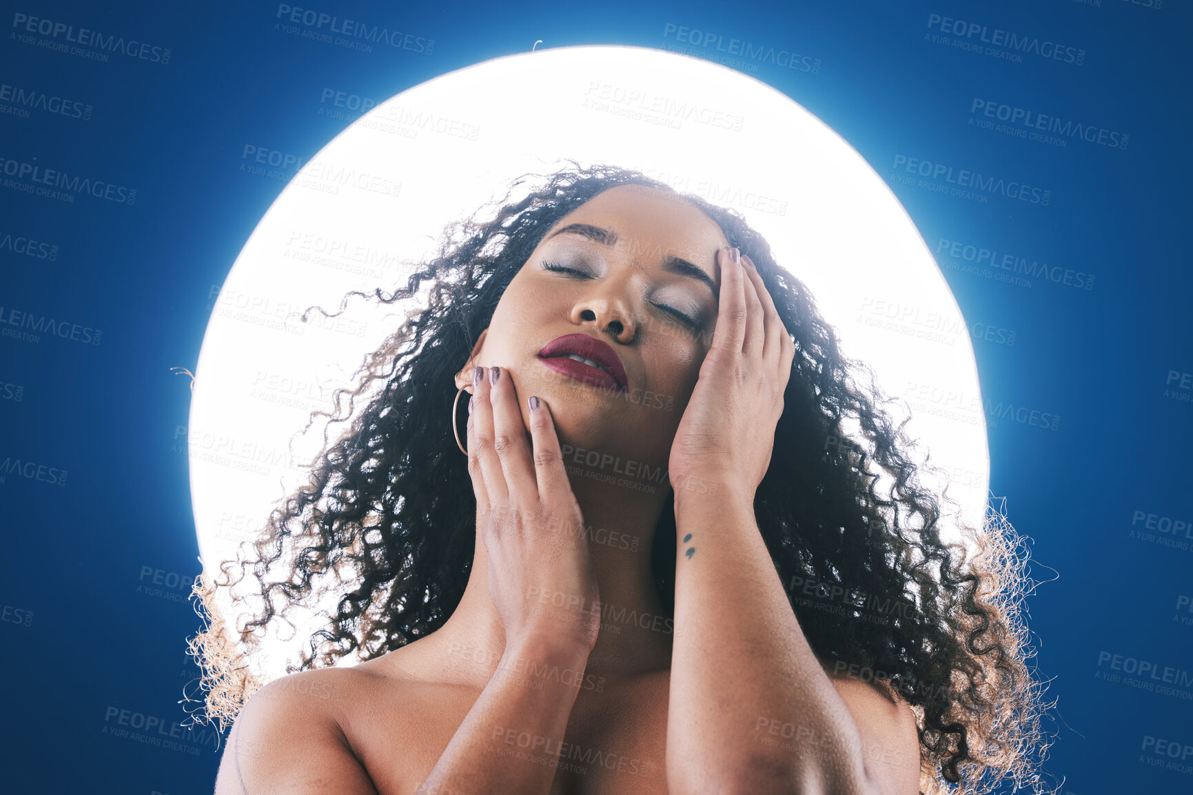 Buy stock photo Skincare, neon light and face of woman with beauty for wellness, cosmetics and facial care in studio. Circle, creative salon and person touch skin for makeup, glamour and aesthetic on blue background