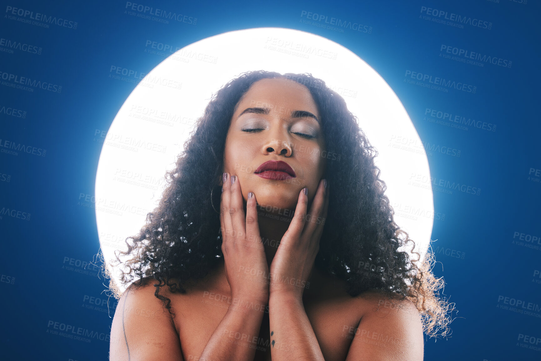 Buy stock photo Makeup, spotlight and face of woman with beauty for wellness, cosmetics and facial in studio. Neon circle, creative salon and person for skincare, glamour or aesthetic on blue background for art deco