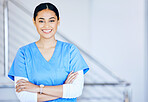 Portrait, nurse and woman with arms crossed, smile and career with healthcare, surgeon and expert in a hospital. Person, medical professional and physician in a clinic, wellness and life insurance 