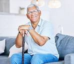 Portrait, home and old man with a walking stick, relax and support with retirement, peace or calm on a couch. Senior person in a living room, elder or pensioner on a sofa, cane or health with a smile