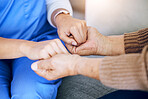 Closeup, nurse and patient holding hands, help and consultation with healthcare, home and support. Zoom, caregiver or pensioner with sympathy, praying and advice with results, hope and rehabilitation