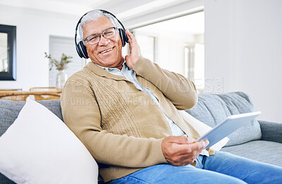 Buy stock photo Portrait, home and old man with tablet, headphones and smile with connection, streaming music and radio. Senior person, technology and pensioner with headset, listening to audio and sound on a couch