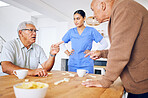 Nurse, senior and fighting over a game of dominoes with people in a retirement home for assisted living. Healthcare, medical and a female medicine professional looking at upset old men arguing