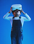 Wow, girl and kid with virtual reality glasses, futuristic and metaverse on a blue studio background. Child, person and model with vr headset, future and online gaming with expression and technology