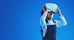 Wow, virtual reality and futuristic with girl, glasses or online gaming on blue studio background. Internet, surprise or child with vr headset, mockup space or digital transformation with video games