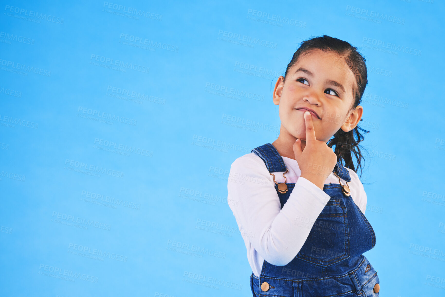 Buy stock photo Thinking, child and girl with ideas, decision and choice on a blue studio background. Mockup space, kid and model with doubt, planning and inspiration with problem solving, question and opportunity