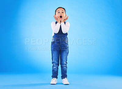 Buy stock photo Shocked, wow and girl surprise with hands to face in studio with fear and scared from danger. Alarm, blue background and young child from Hawaii with scary, omg and emoji face of a kid in danger