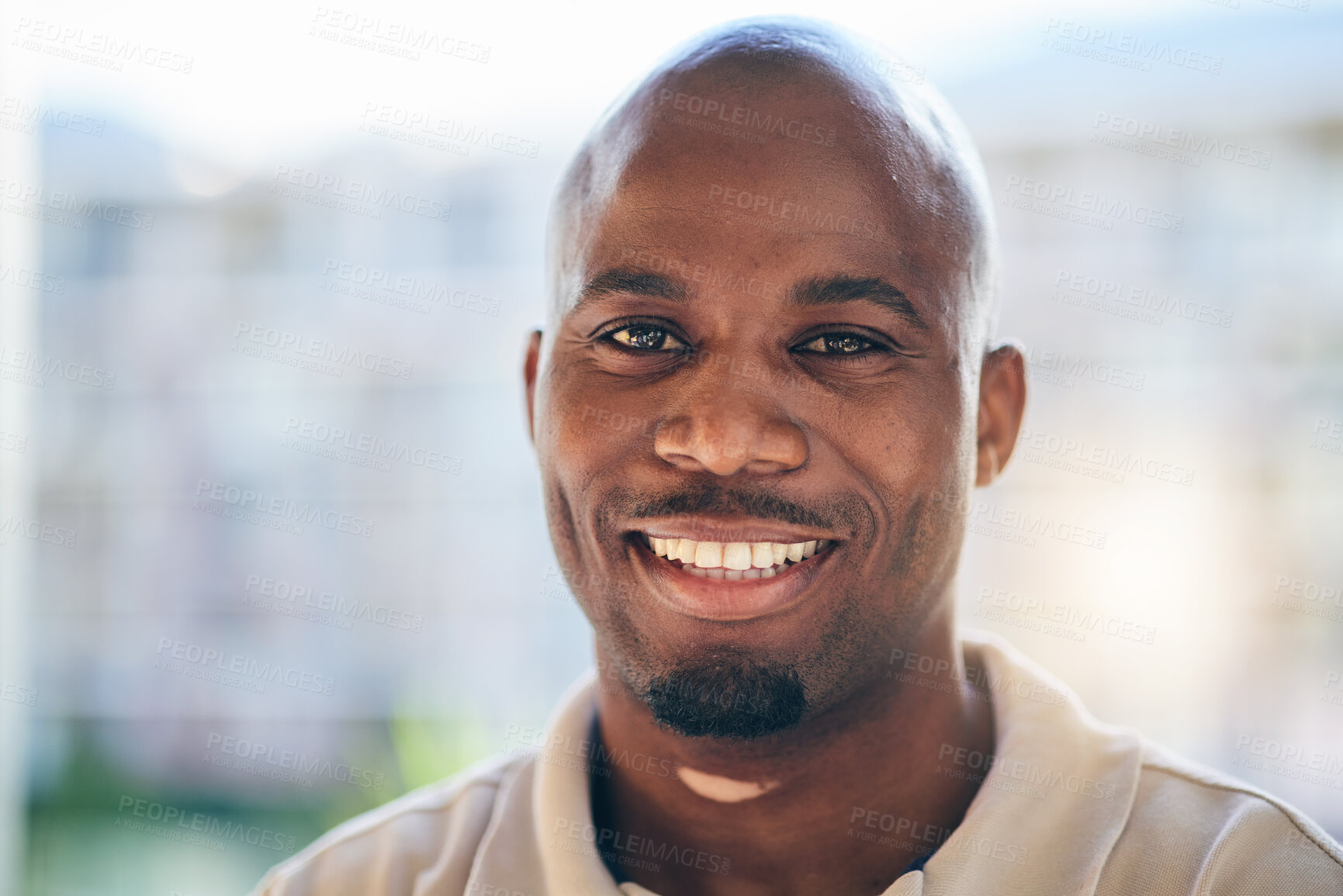 Buy stock photo Smile, happy and portrait of a businessman in the office with confidence and positive attitude. Young, career and face headshot of professional African male designer standing in a modern workplace.