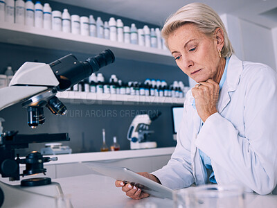 Buy stock photo Science, tablet and thinking with woman in laboratory for research, medical and pharmacy. Medicine, healthcare and digital report with mature scientist reading online for email, data and results