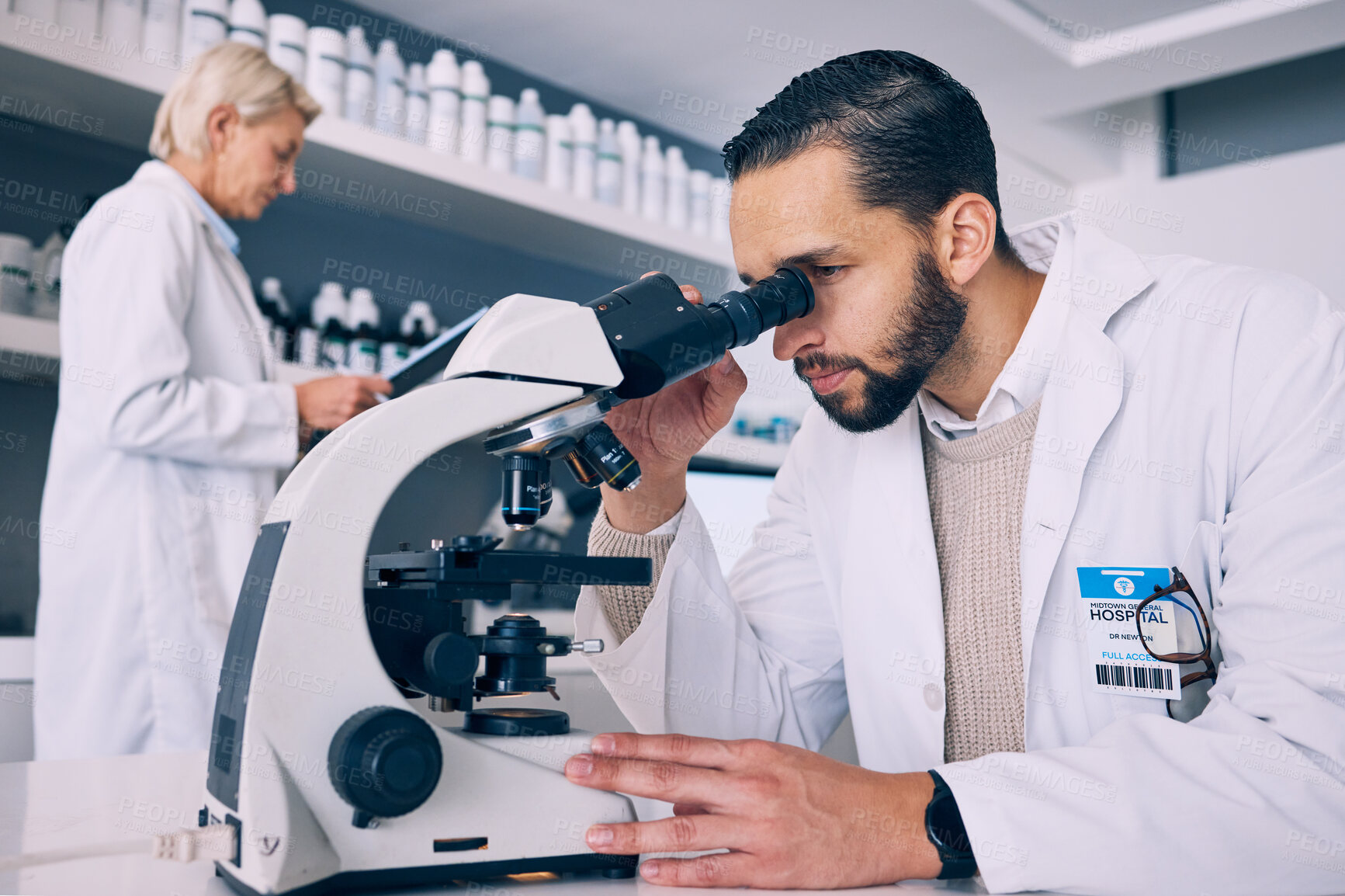 Buy stock photo Scientist man, microscope analysis and lab for medical research, molecules or particles of bacteria at pharma job. Science team, people and vision for studying virus with pharmaceutical innovation