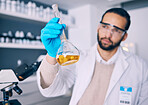 Science laboratory, chemical analysis and man check medicine progress, lab research or medical development. Chemistry process, beaker experiment and male scientist investigation of liquid solution