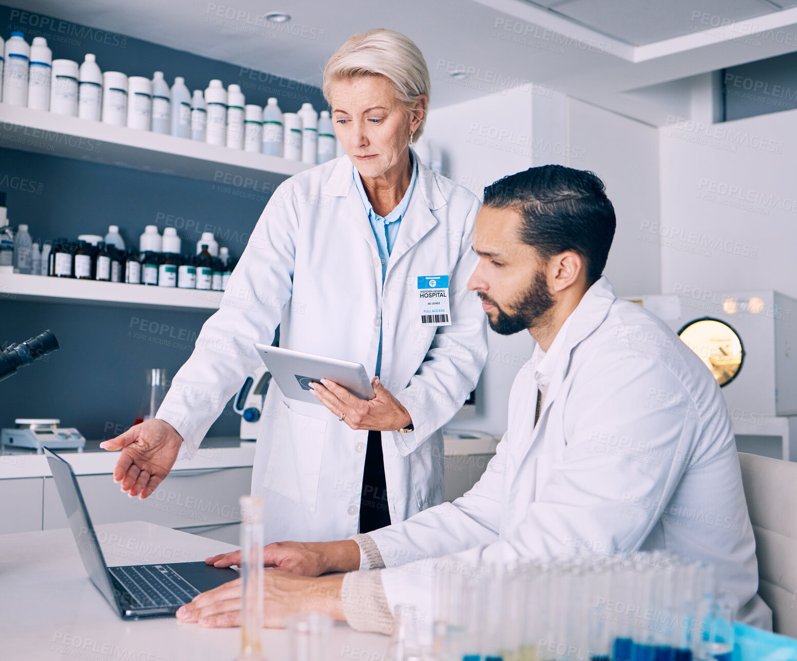 Buy stock photo Scientist, mentor and training on computer and tablet for data analysis, laboratory report and pharmaceutical research. Science or medical woman and man talking, medicine support and digital solution