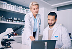 Scientist, mentor and training on computer for research, data analysis and laboratory report in pharmaceutical solution. Science or medical woman and man with teamwork and medicine support on laptop