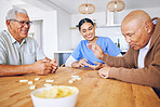 Dominoes, caregiver and senior men playing a game as entertainment or bonding together in a retirement home. Happy, fun and elderly people enjoy mental rehabilitation and development with nurse