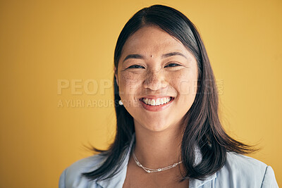 Buy stock photo Face, smile and Asian woman, designer and entrepreneur in studio isolated on a yellow background mockup space. Portrait, happy and creative professional, worker and  startup employee in Cambodia.