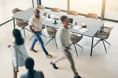 Buy stock photo Above, busy office and fast walking business people for corporate career, moving and speed. Blur, morning and diversity of employees in the workplace together for a professional company in motion