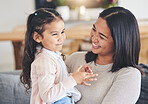 Hug, happy and playful with mother and daughter on sofa for love, care and support. Funny, calm and relax with woman and young girl embrace in living room of family home for peace, cute and bonding