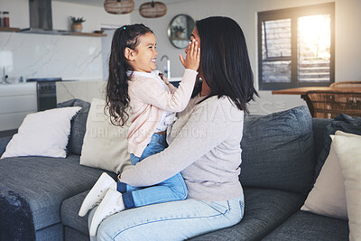 Buy stock photo Touch, happy and playful with mother and daughter on sofa for love, care and support. Funny, calm and relax with woman and young girl embrace in living room of family home for peace, cute and bonding