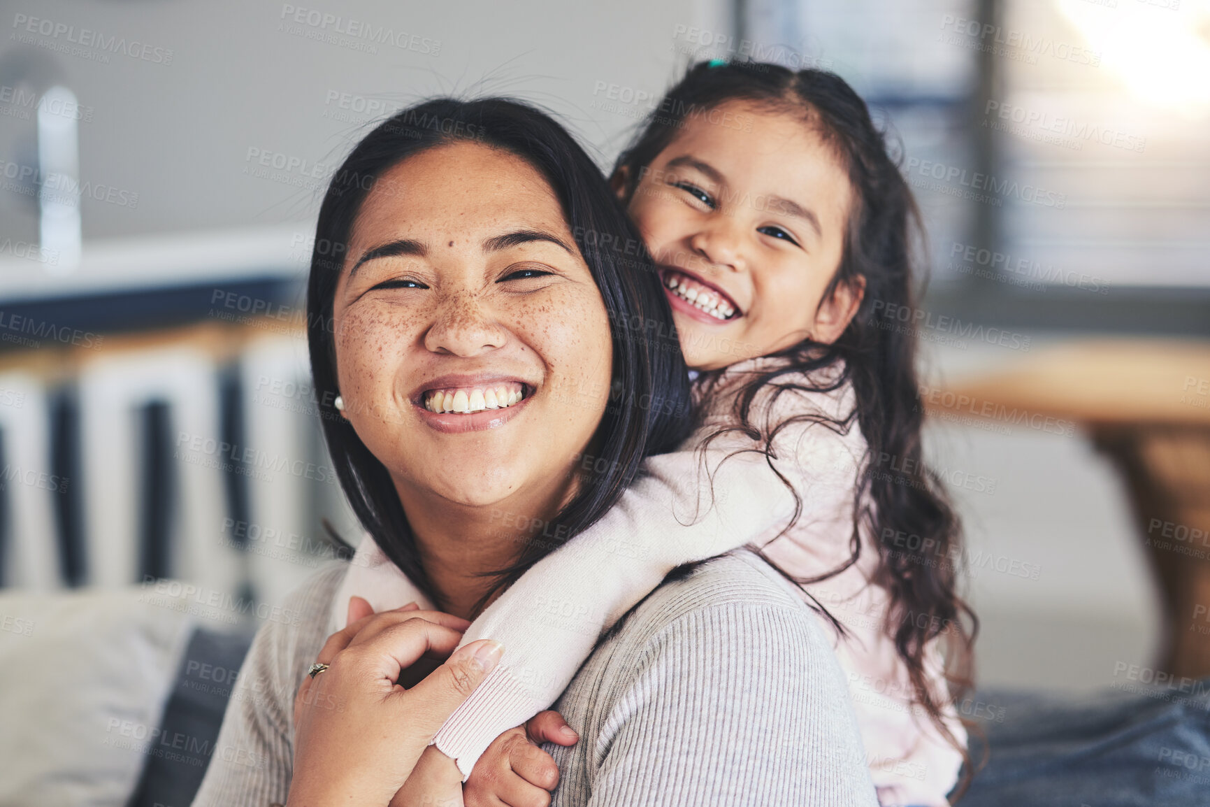 Buy stock photo Hug, mother and daughter smile for a portrait at home with love, care and happiness. A young woman and girl child together on a lounge sofa for fun time, playing and security or relax in family house