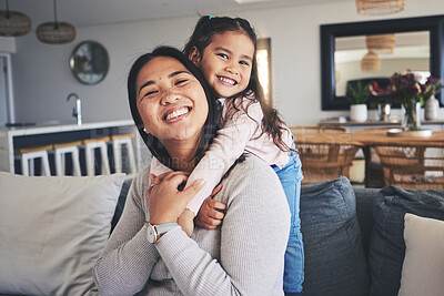 Buy stock photo Hug, smile and portrait of mother and daughter on sofa for love, care and support. Happy, calm and relax with woman and young girl embrace in living room of family home for peace, cute and bonding