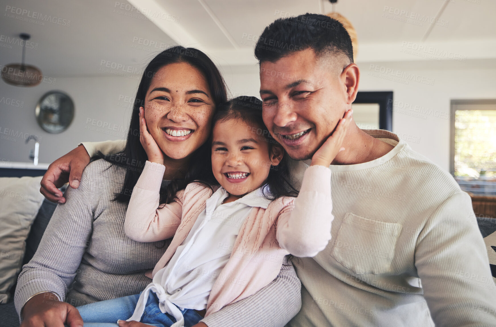 Buy stock photo Happy, love and relax with family on sofa for smile, bonding and support. Hug, happiness and lounge with Mexico parents with child and embrace in living room at home for calm, cheerful and peace
